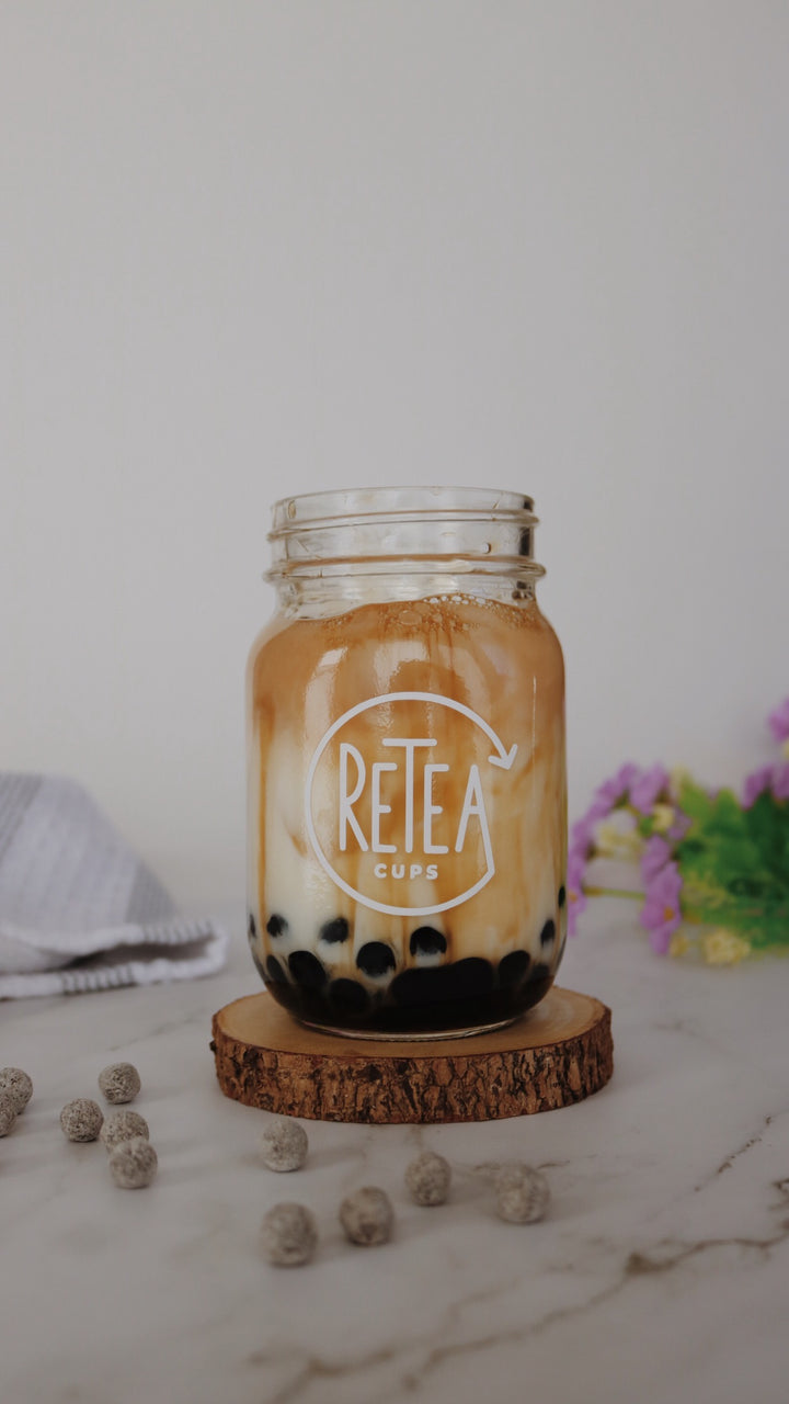 Brown sugar milk tea with tapioca in a reusable bubble tea cup