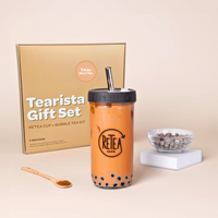 Tearista gift set with bubble tea cup, tea kit, and packaging on a beige background