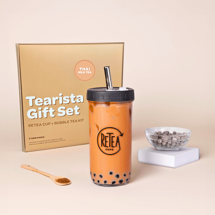 Tearista gift set with bubble tea cup, tea kit, and packaging on a beige background